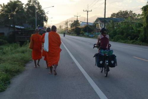 Early morning rides- the monks are collection food. 